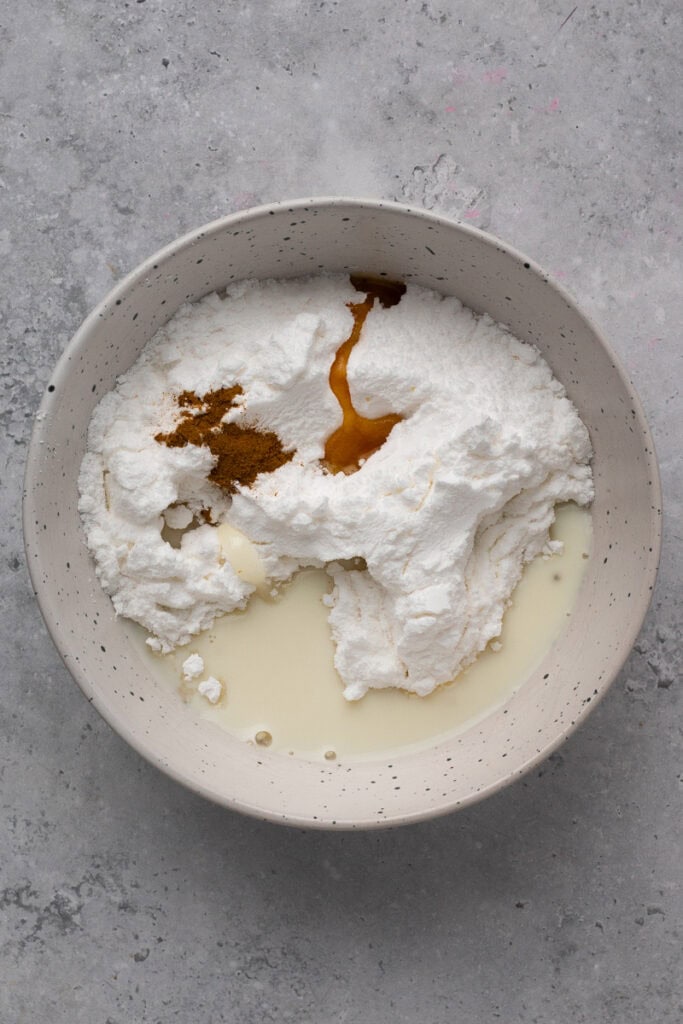 Glaze ingredients un mixed in a bowl for gluten free apple fritters