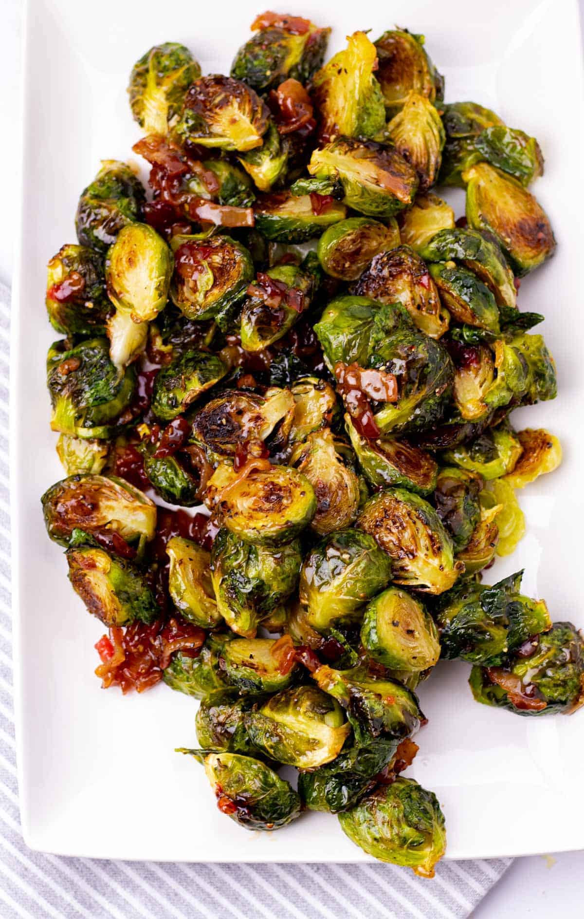 Cooked brussel sprouts on a white plate