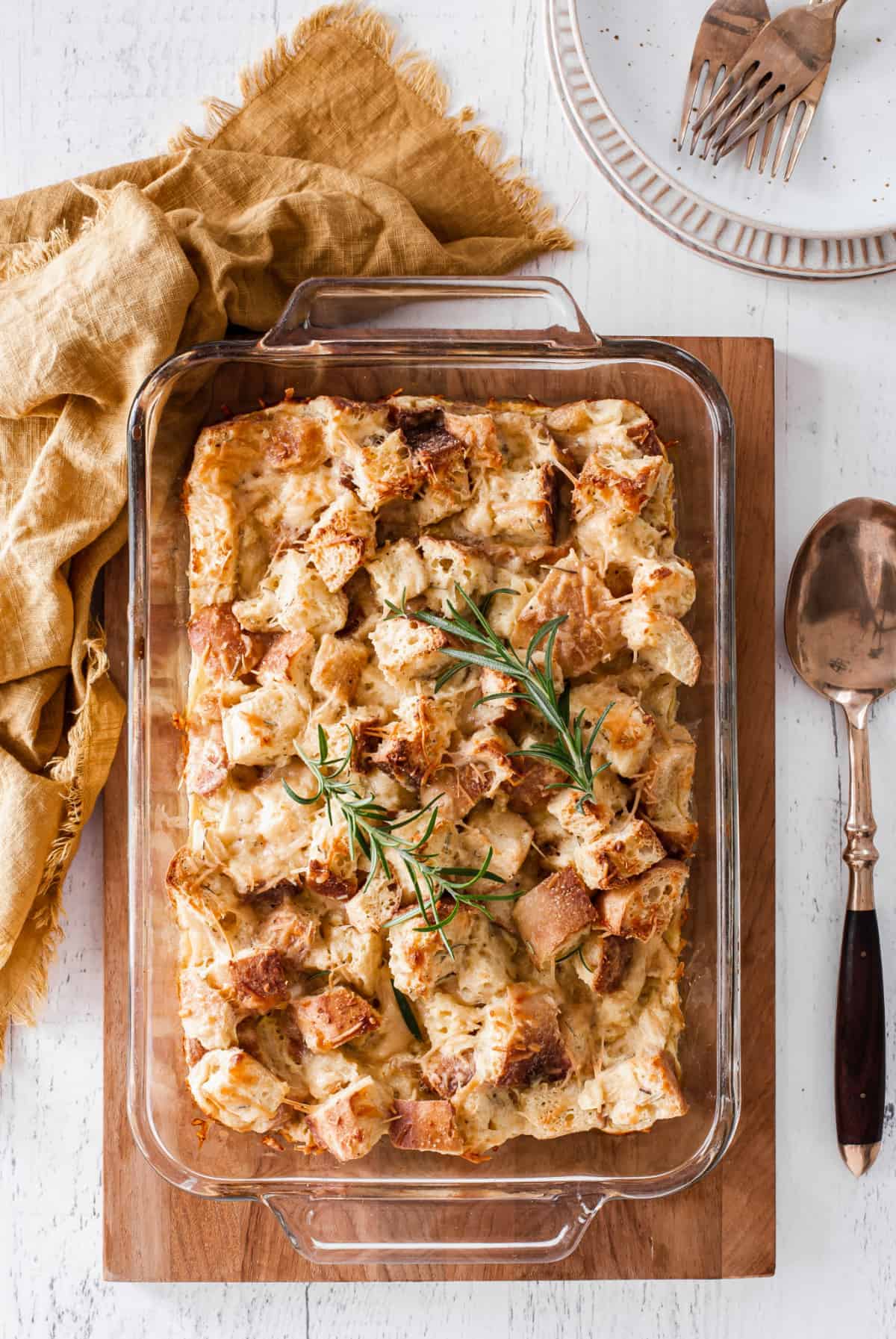 Parmesan and rosemary bread pudding in a casserole dish