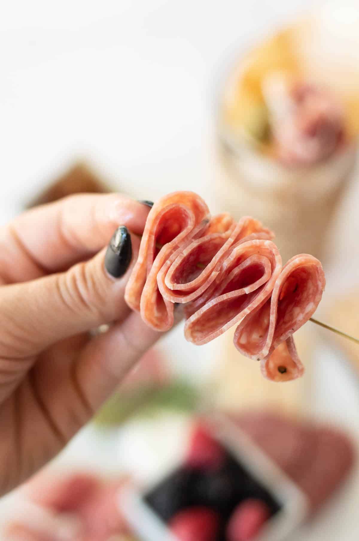 Charcuterie Cones making salami on a toothpick