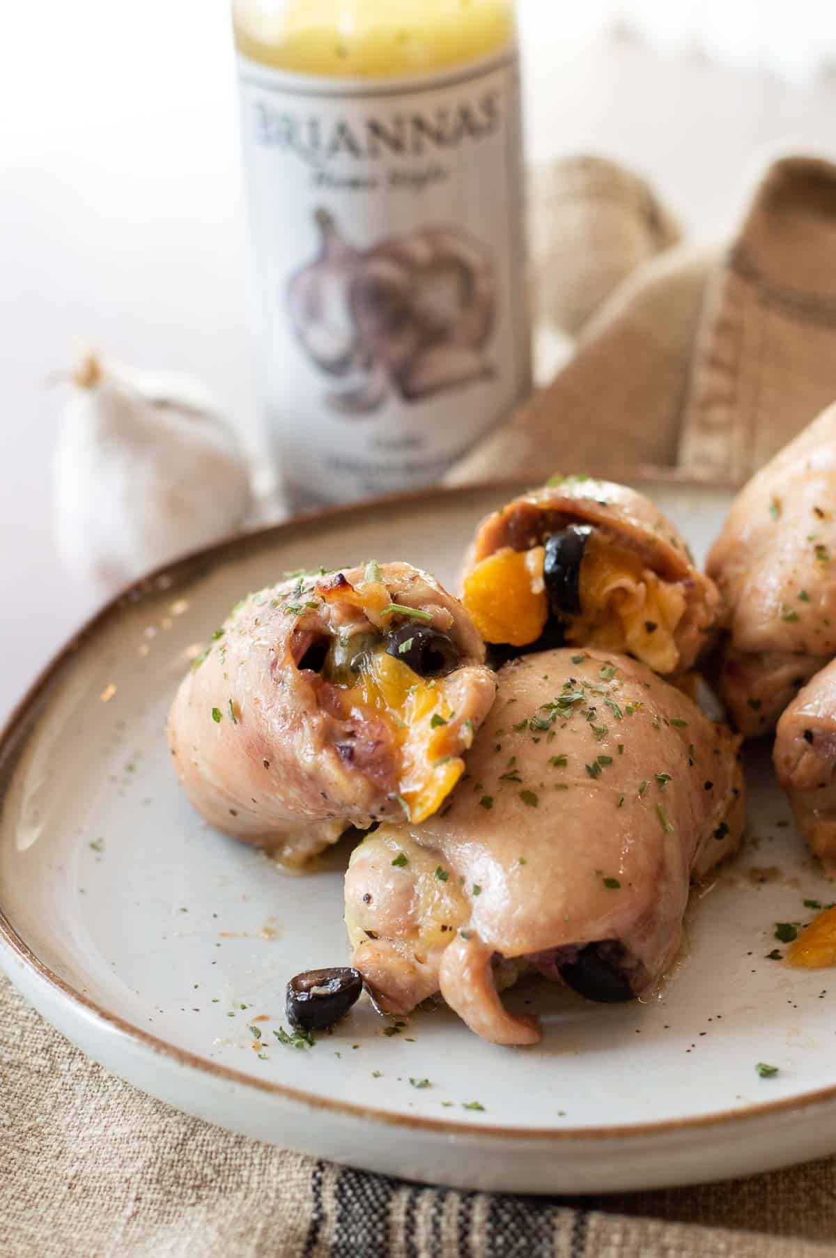 garlic stuffed chicken thighs on a plate