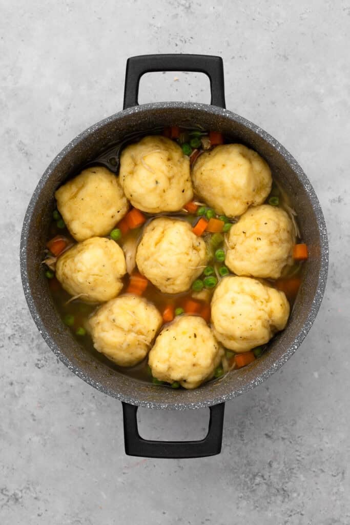 top down image of chicken and dumplings with large fluffy dumplings