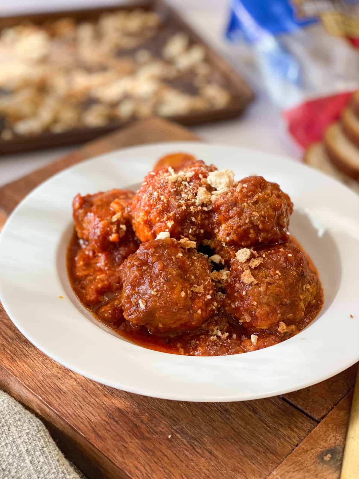 Easy Gluten Free Meatballs in a white bowl with breadcrumbs