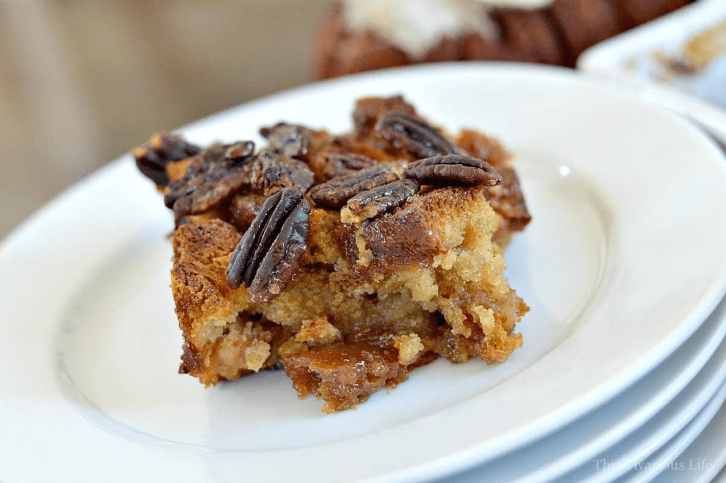 Gluten-free pecan pie bread pudding on a white plate