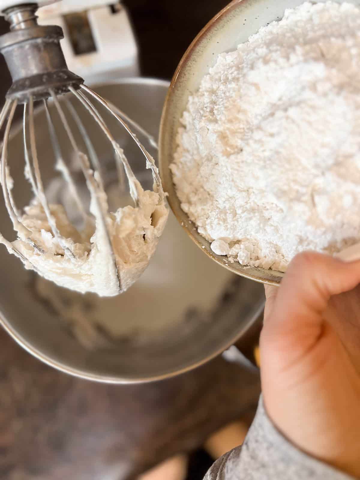 powdered sugar going into a bowl