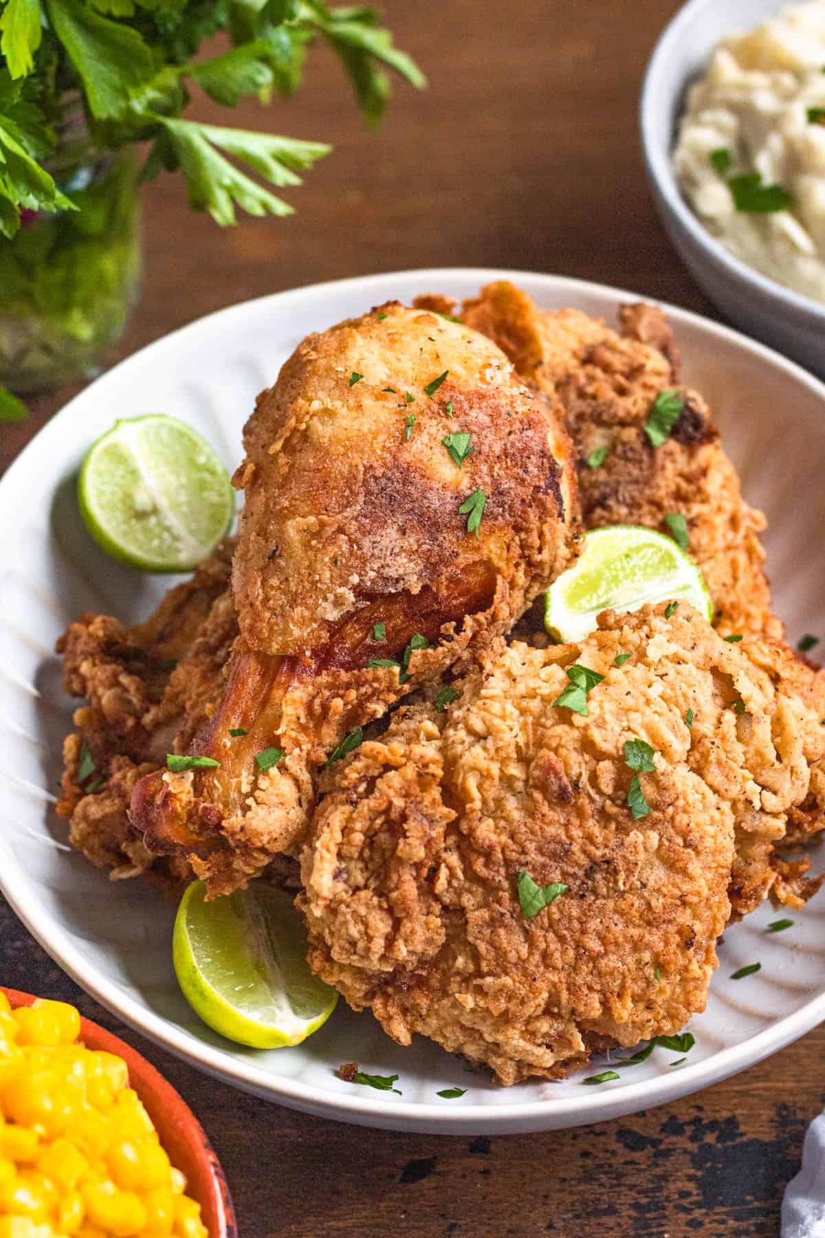Gluten Free Fried Chicken Recipe on a plate with limes