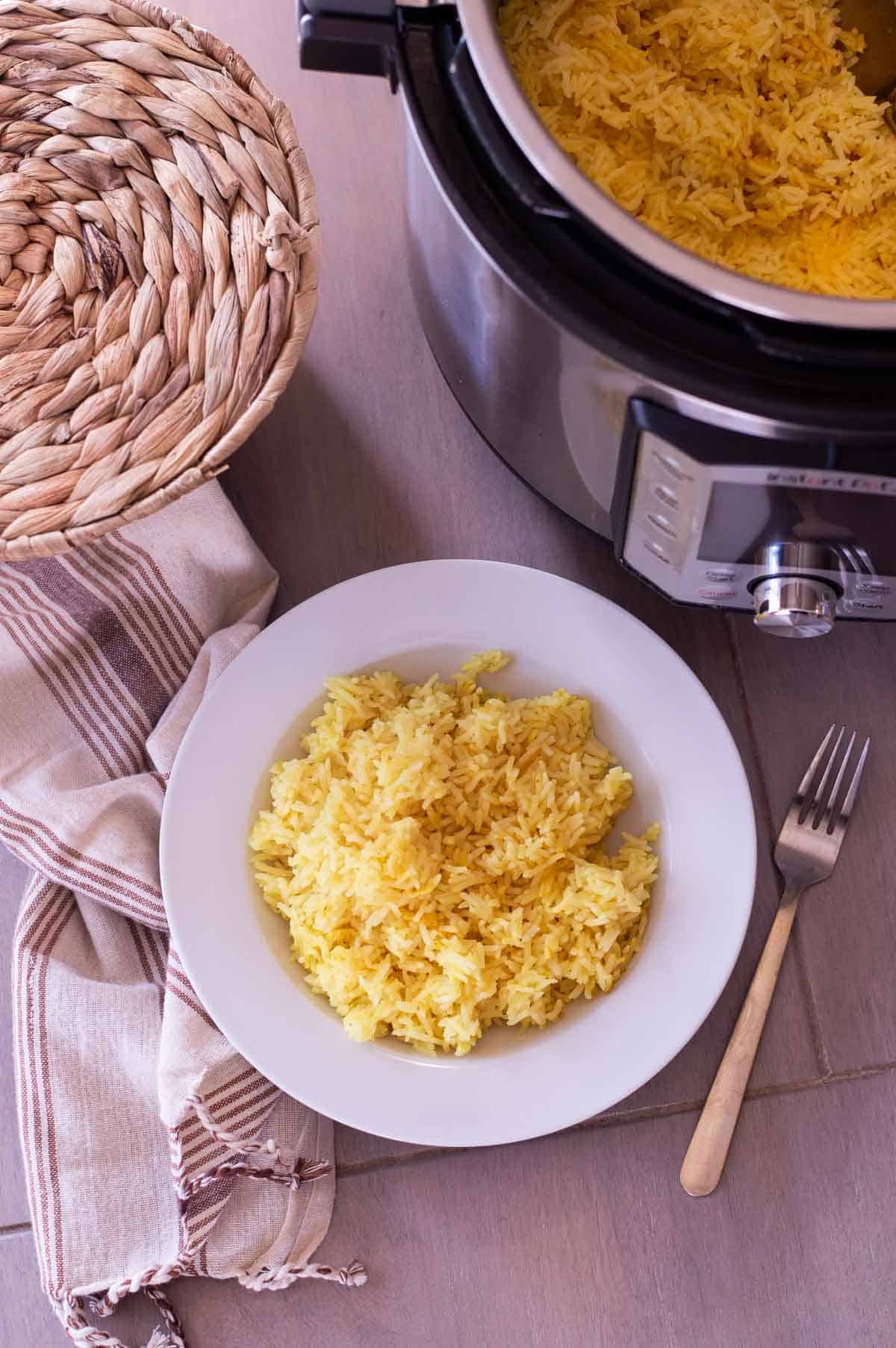 yellow Indian style rice in a white bowl
