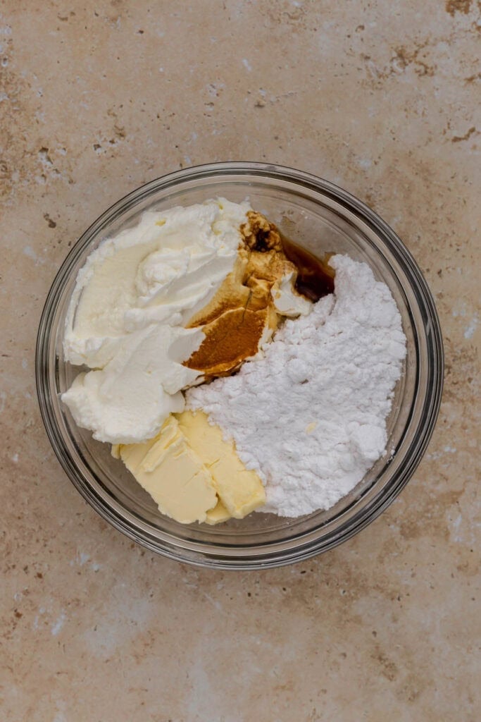 cinnamon roll frosting ingredients in a bowl