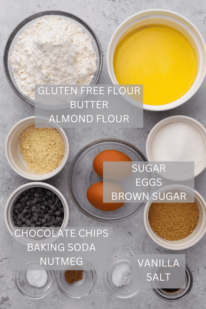 top down image of ingredients for gluten free chocolate chip cookies in small bowls on a grey counter with titles above each ingredient