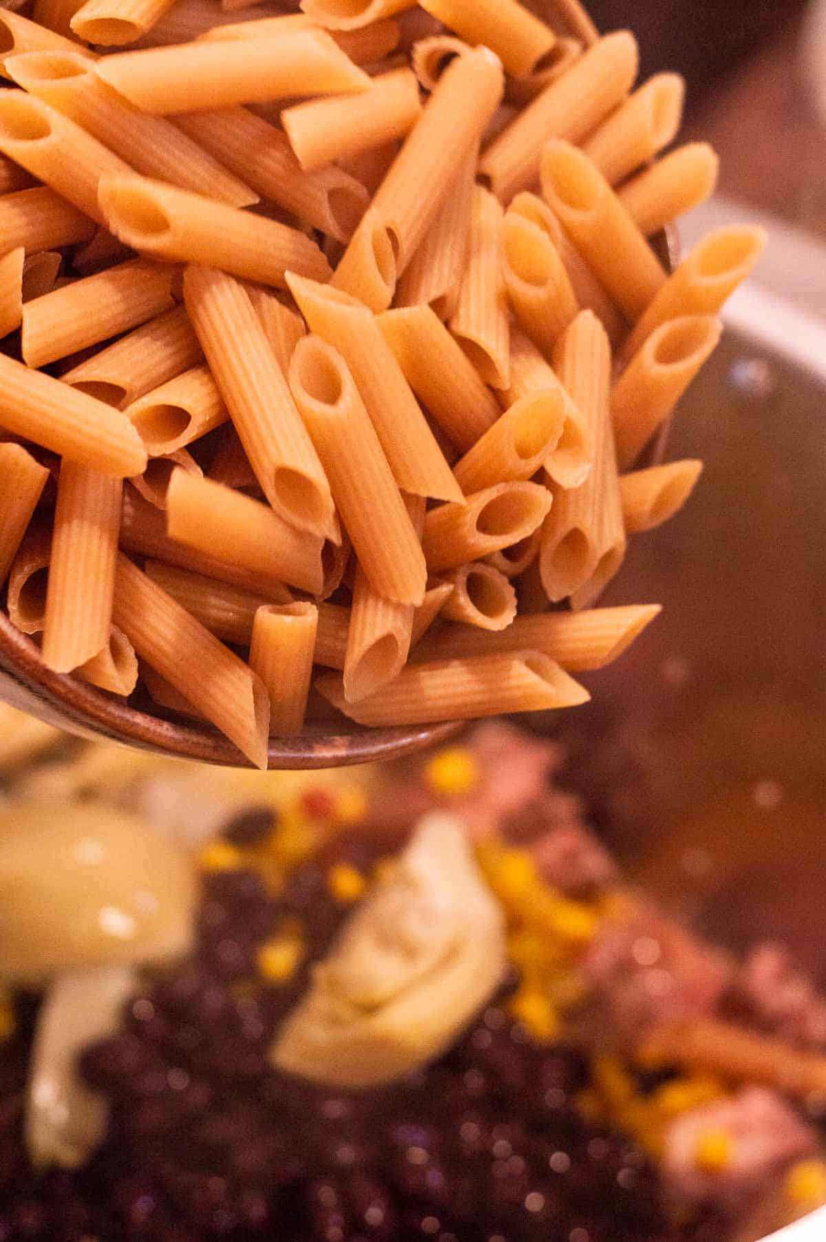 pasta being poured into the pot