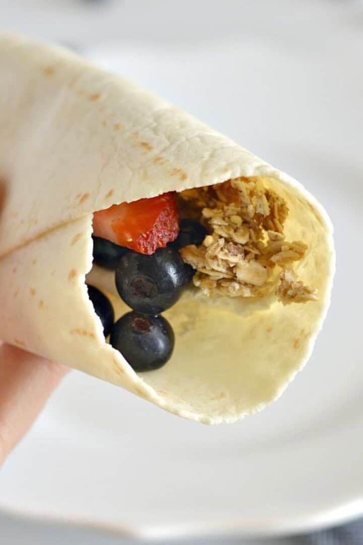 tortilla wrapped in a hand