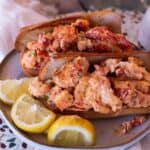 Gluten Free Lobster Rolls on a plate with lemon