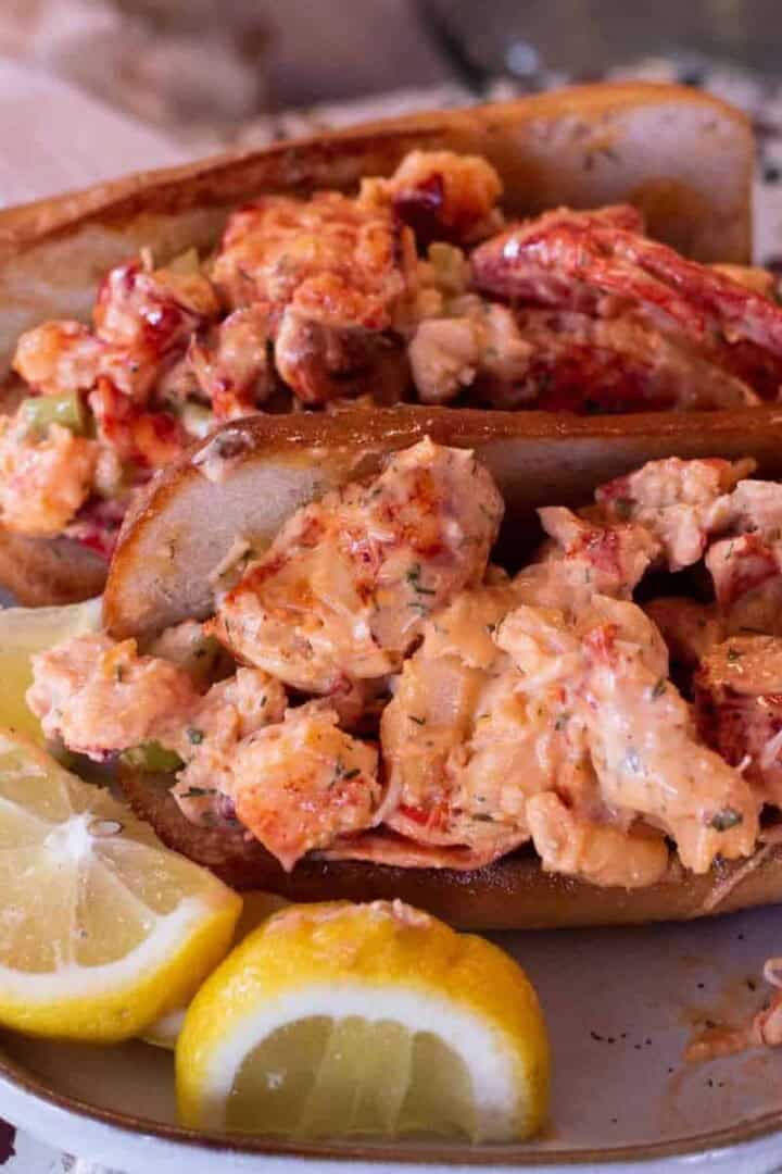 Gluten Free Lobster Rolls on a plate with lemon