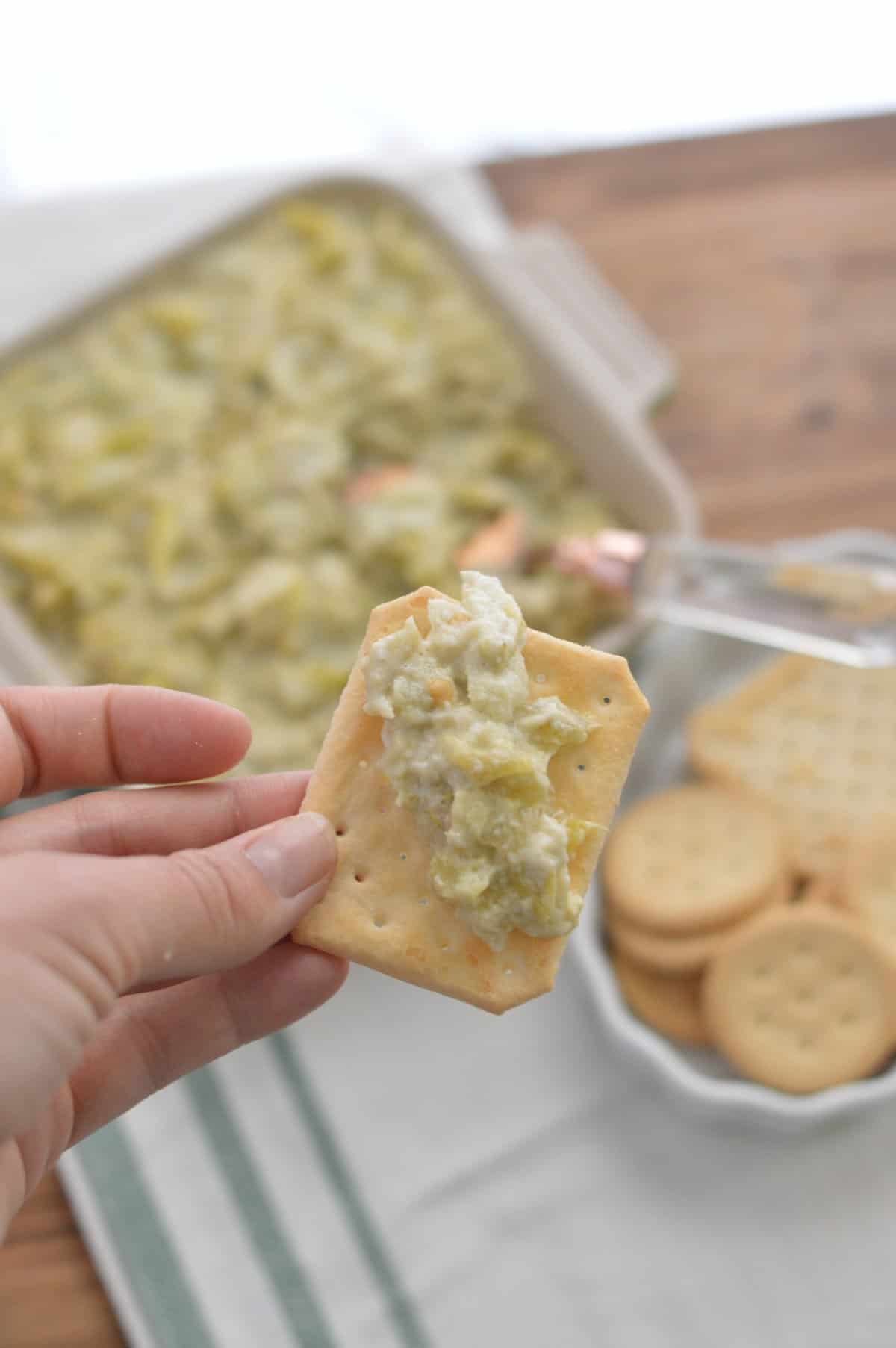 gluten free cracker with artichoke dip