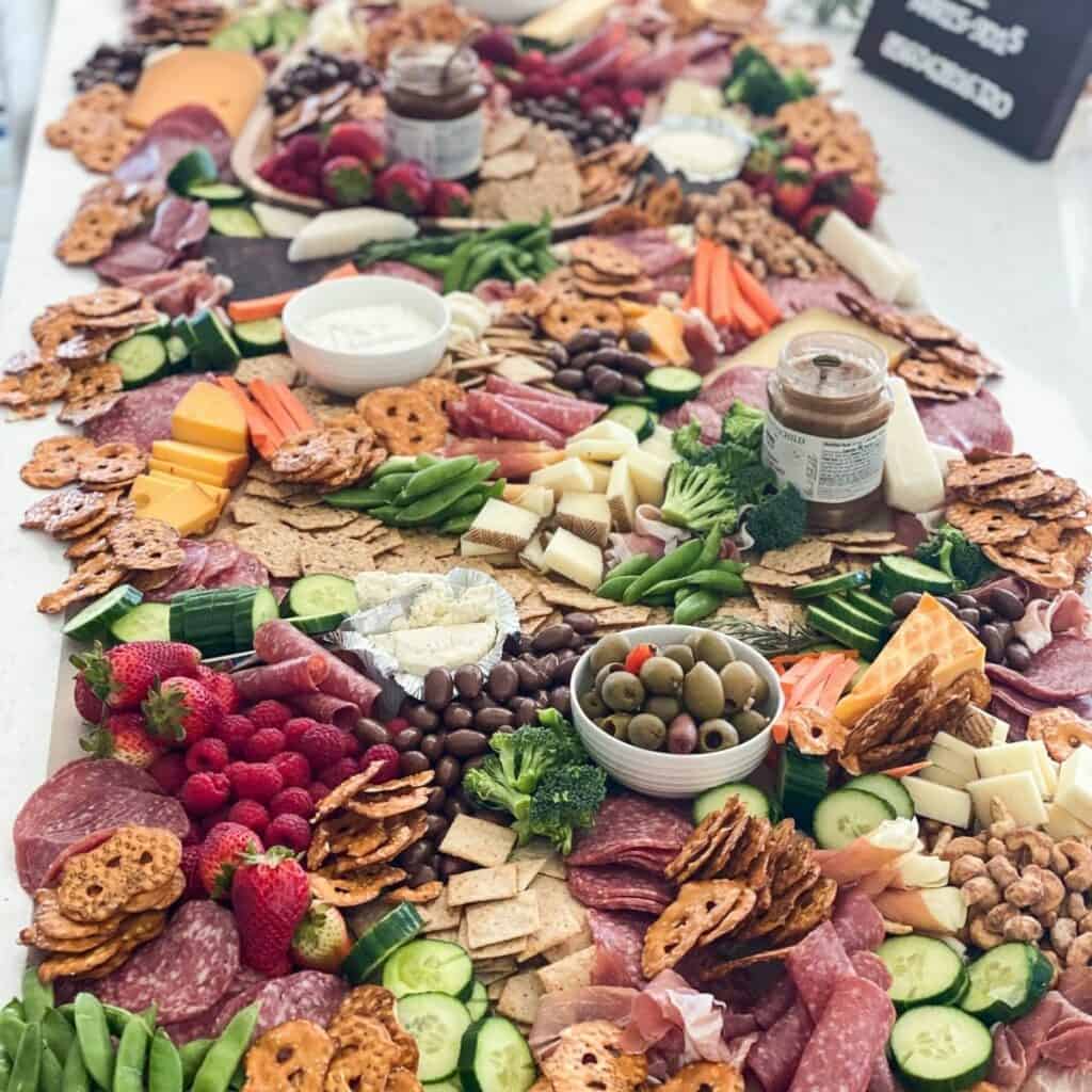 giant grazing table with cheese and charcuterie