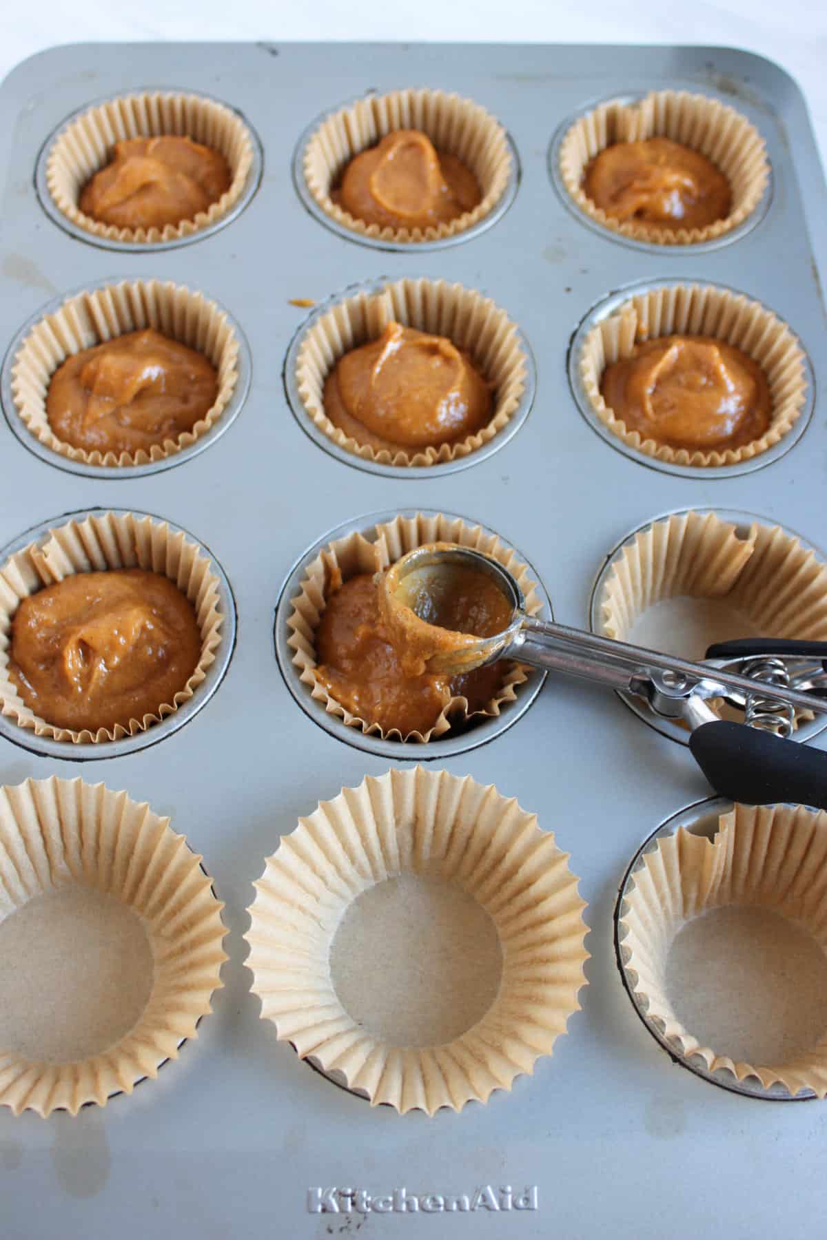 Soft Gluten Free Pumpkin Cupcakes batter in paper cups