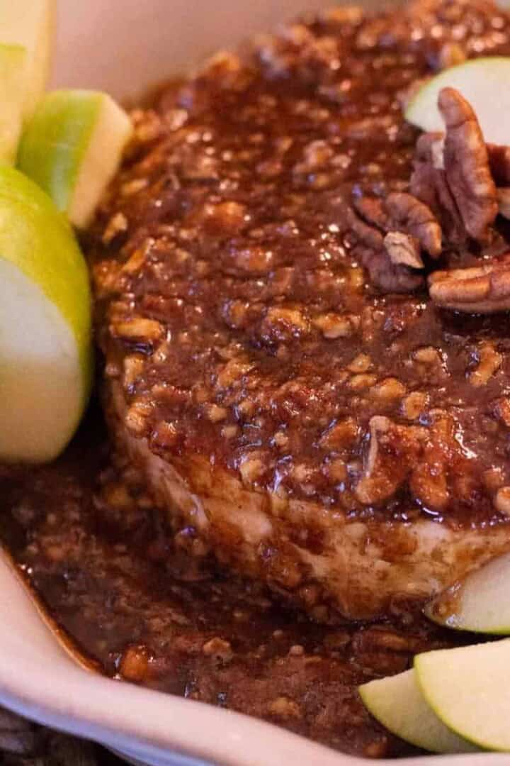 Baked Brie with Jam in a pie pan with apples and nuts