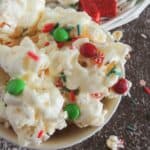 Easy Christmas Popcorn with red and green M&M's in a bowl