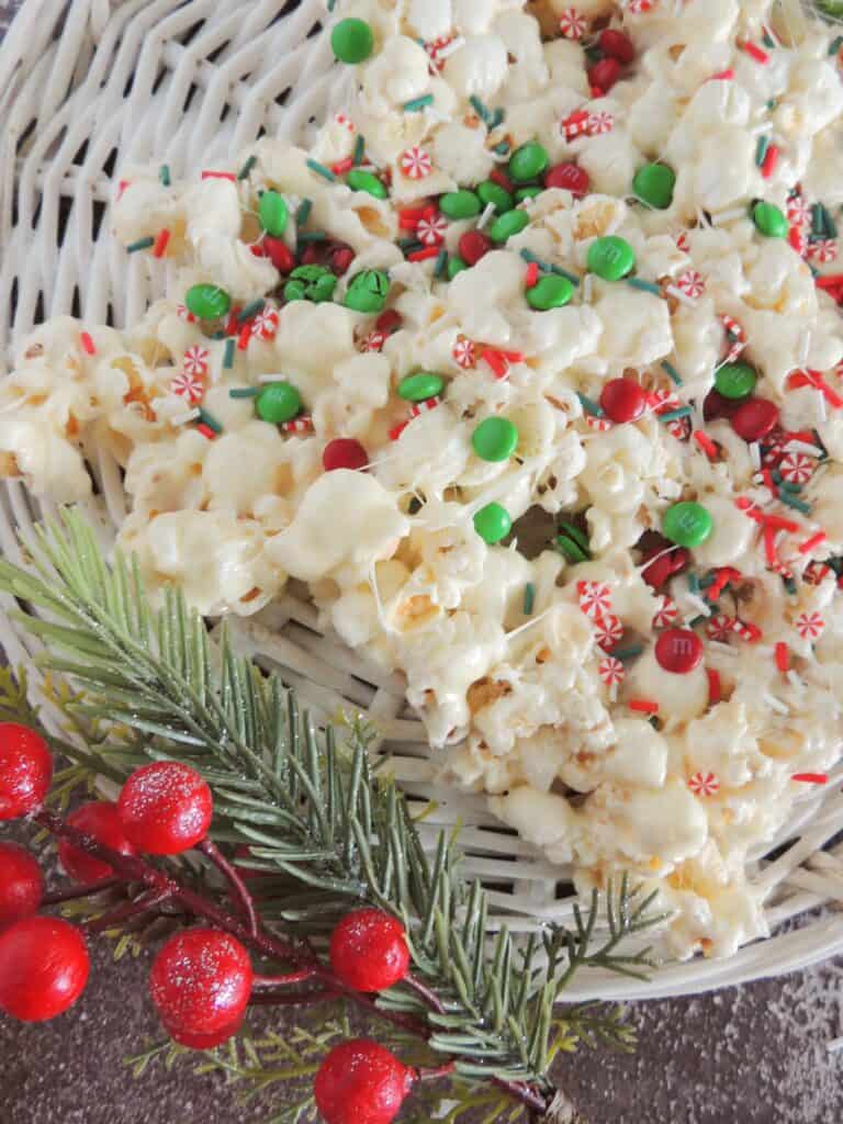 Christmas popcorn in a bowl with red and green M&M's