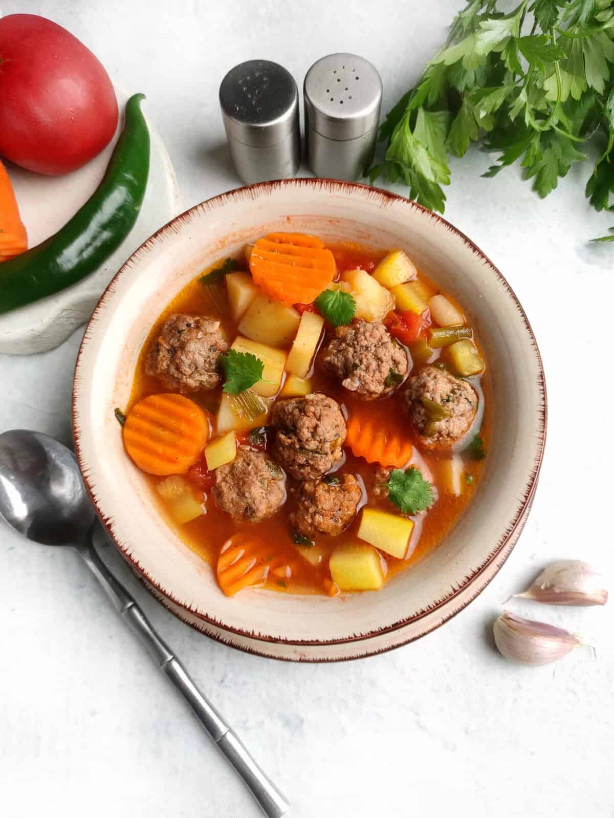 Easy Albondigas Soup (Mexican meatball soup) in a bowl with veggies and meatballs