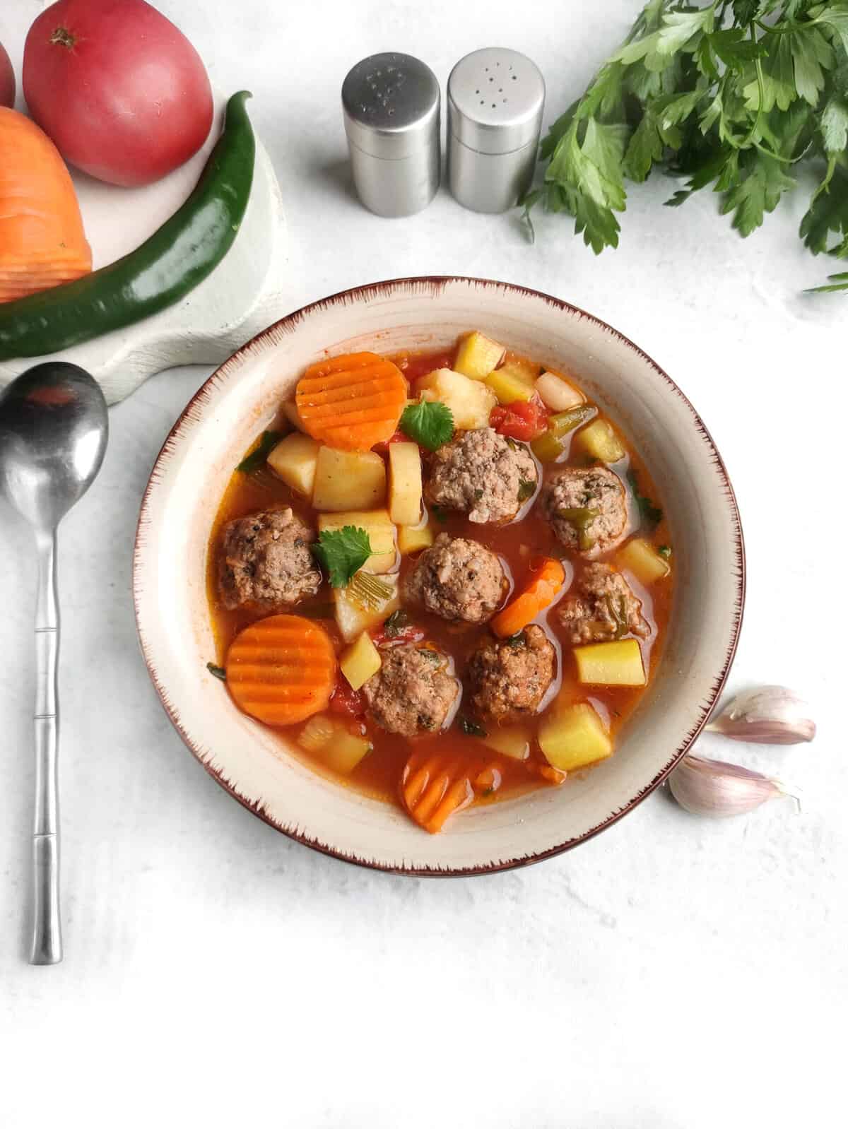 Easy Albondigas Soup (Mexican meatball soup) in a bowl with veggies and meatballs