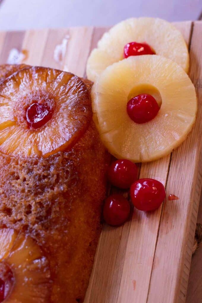 Gluten free pineapple upside down cake with pineapple rings and maraschino cherries