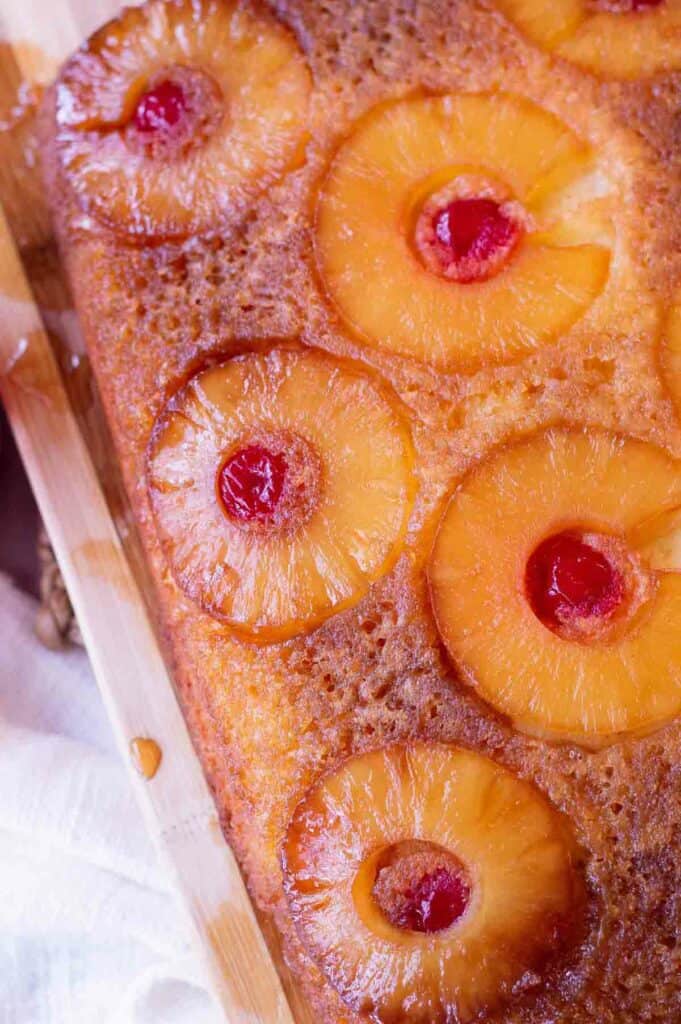 Gluten free pineapple upside down cake with pineapple rings and maraschino cherries