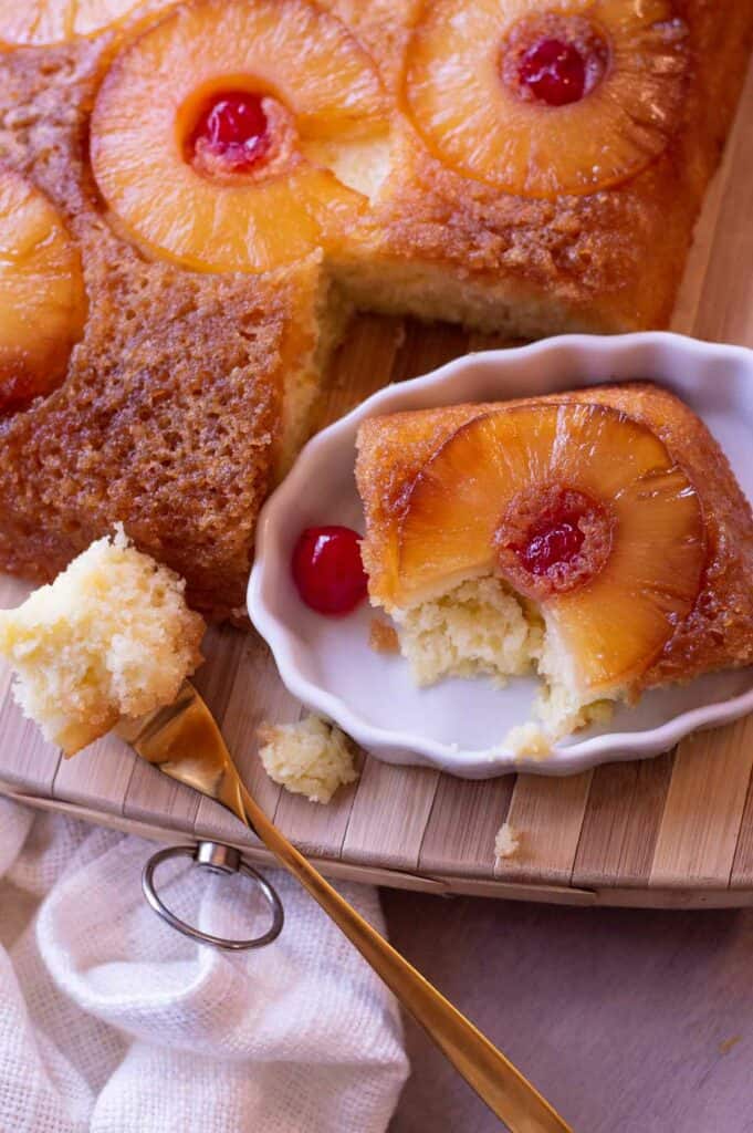 Gluten free pineapple upside down cake with pineapple rings and maraschino cherries