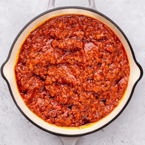 Top down image of gluten free pasta with meat in a saucepan