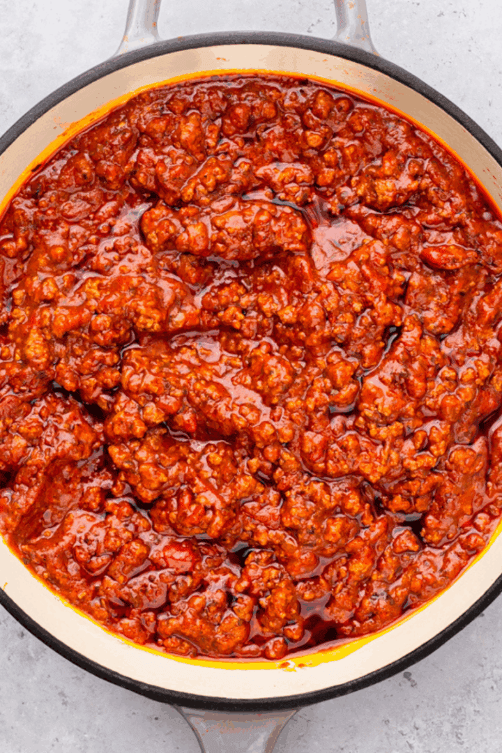 Top down image of gluten free pasta with meat in a saucepan