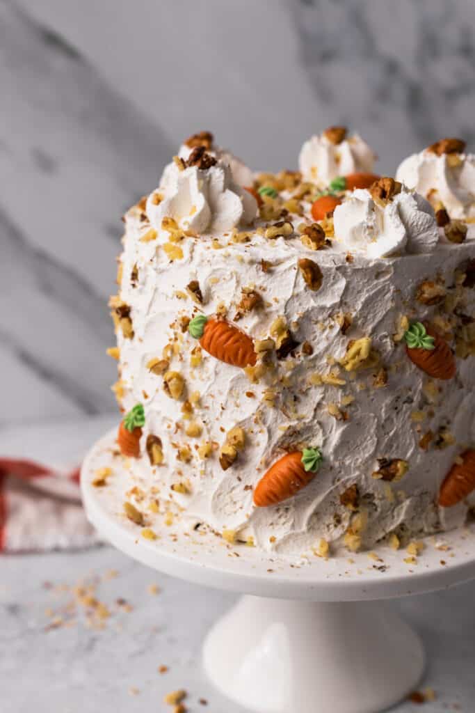 The BEST Gluten Free Carrot Cake on a cake stand