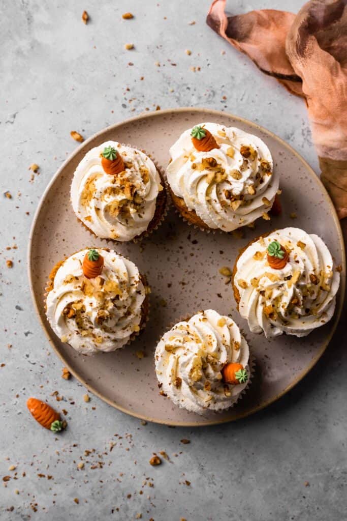 Gluten Free Carrot Cake Cupcakes on a plate frosted