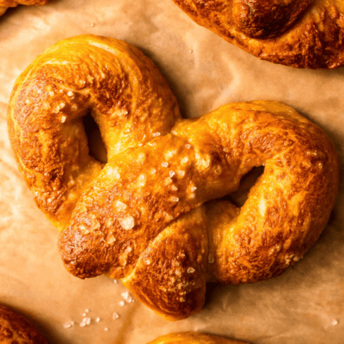 Gluten Free Soft Pretzels on parchment paper square image
