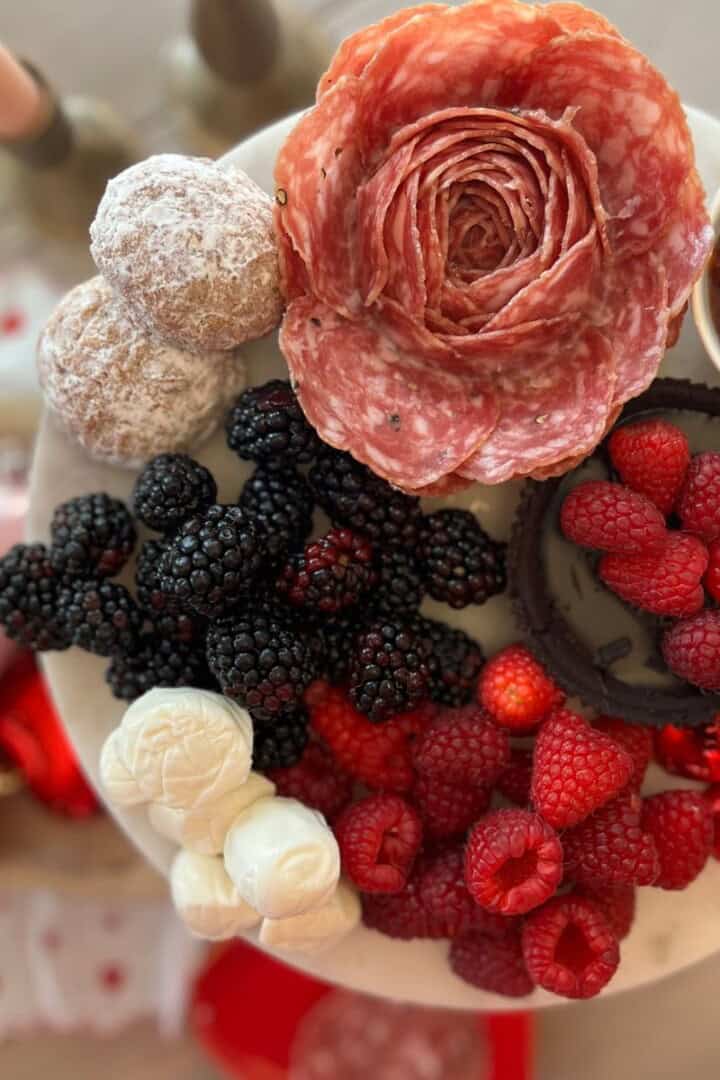 Charcuterie Rose on a platter with fruit