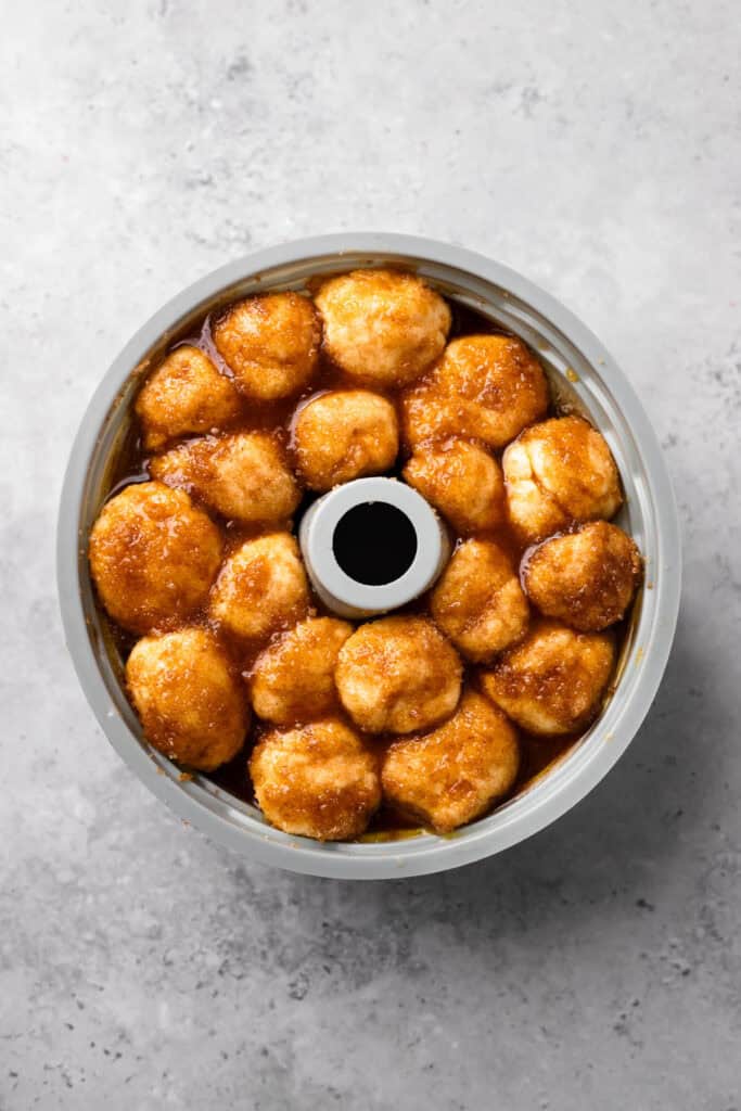 Soft Gluten Free Monkey Bread dough balls in bundt pan