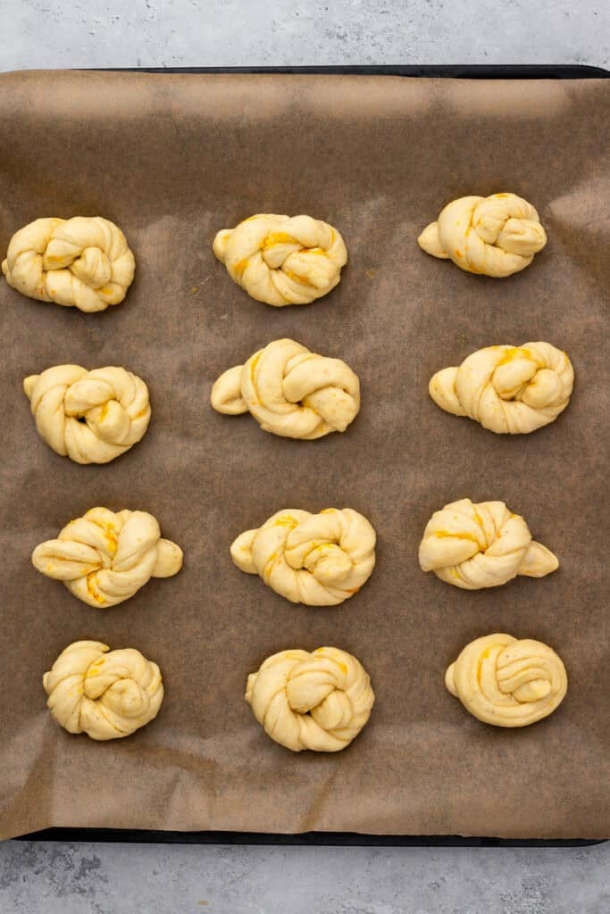 orange knots on a baking sheet