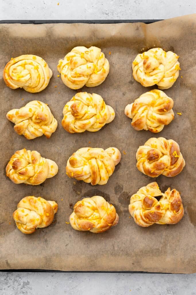 Gluten free orange rolls baked on a tray