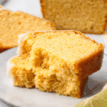 gluten free pound cake stacked on top of each other on white plate to show soft and buttery texture