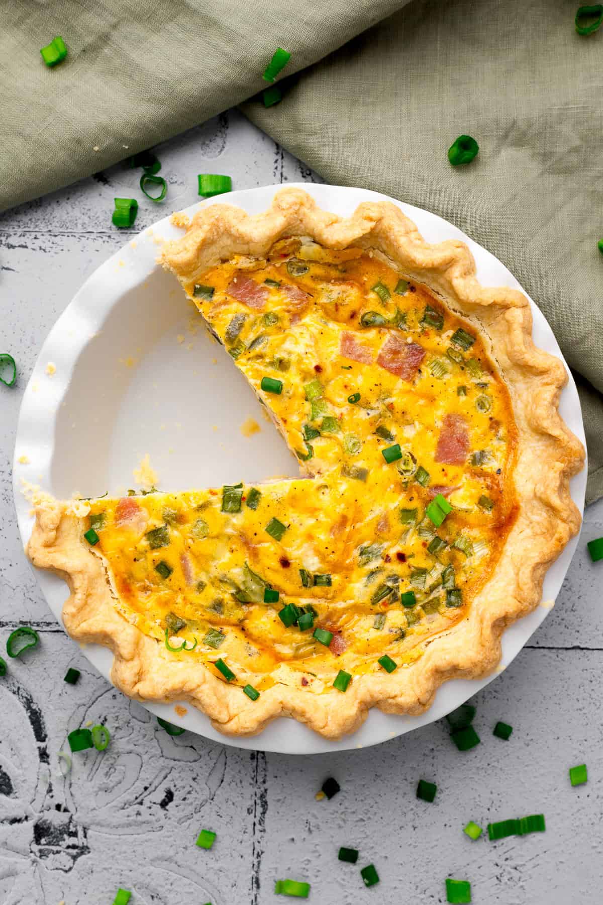 Easy Gluten Free Quiche with a slice taken out in a pie pan