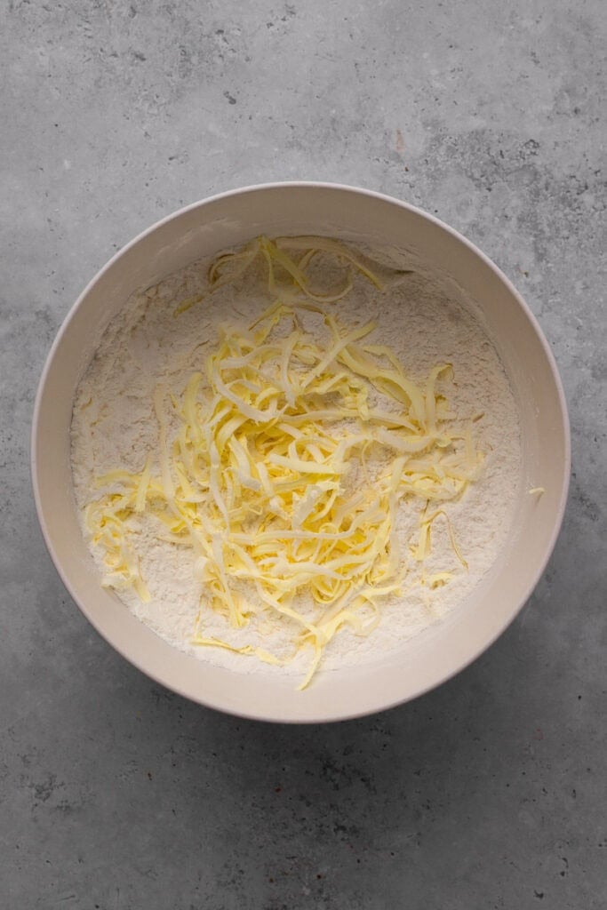 Gluten free cheddar biscuits dough dry ingredients with butter grated in