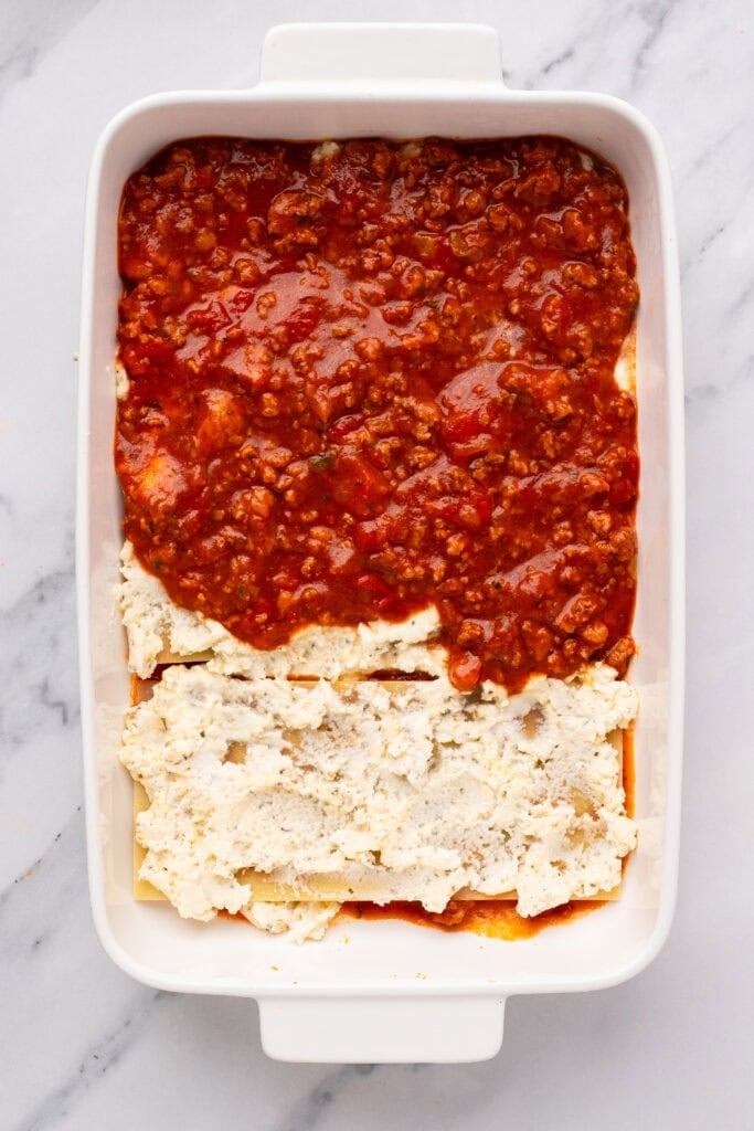 Homemade Gluten Free Lasagna being prepared with noodles and sauce