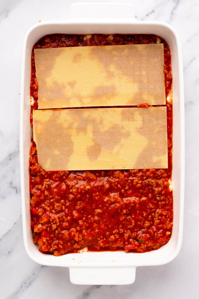 Homemade Gluten Free Lasagna being prepared with noodles and sauce