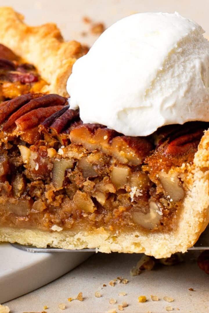 Gluten Free Pecan Pie with No Corn Syrup with a slice cut out and icecream on top