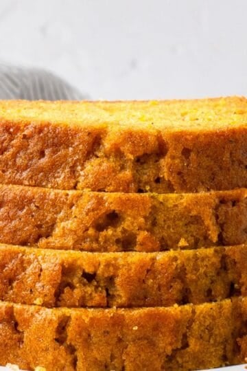 Super Soft Gluten Free Pumpkin Bread stacked and showing the inside texture