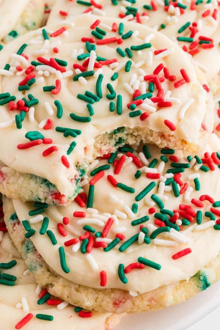 Christmas Crumbl Cookies Gluten Free stacked with sprinkles and bite taken out