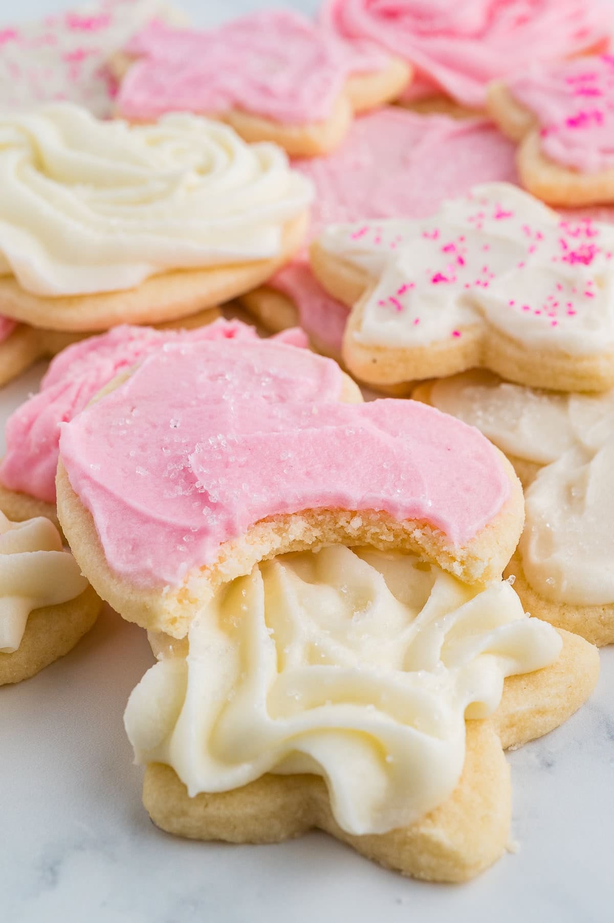 Soft Gluten Free Sugar Cookies rolled out and cut, baked and frosted