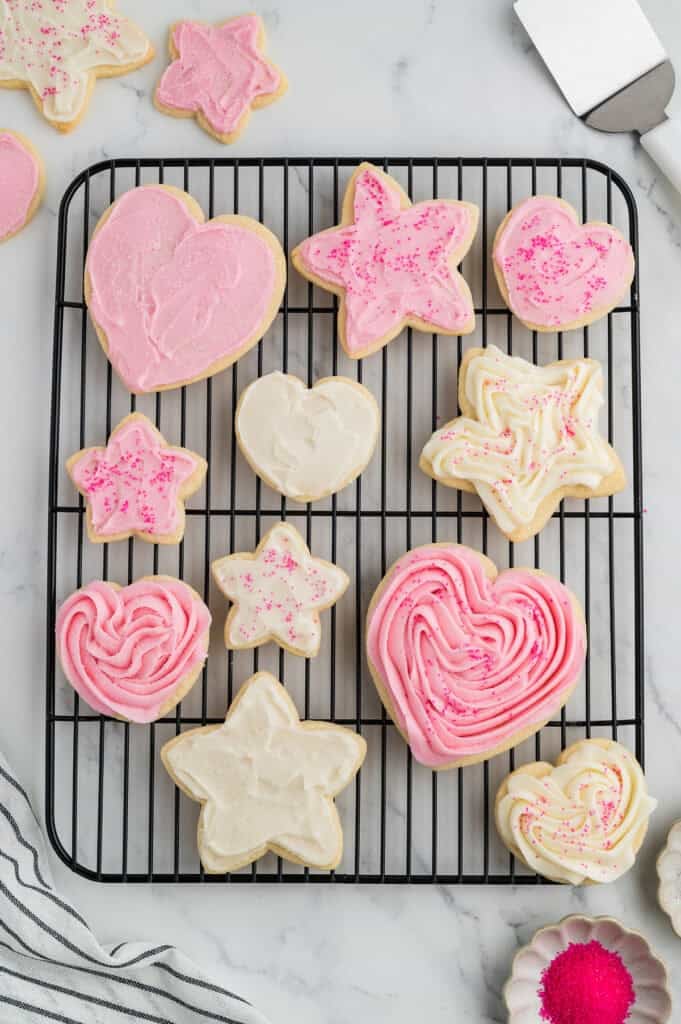 Soft Gluten Free Sugar Cookies rolled out and cut, baked and frosted