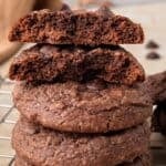 The BEST Gluten Free Chocolate Cookie Recipe (Soft or Crunchy!) stacked on top of each other with a bite taken out.