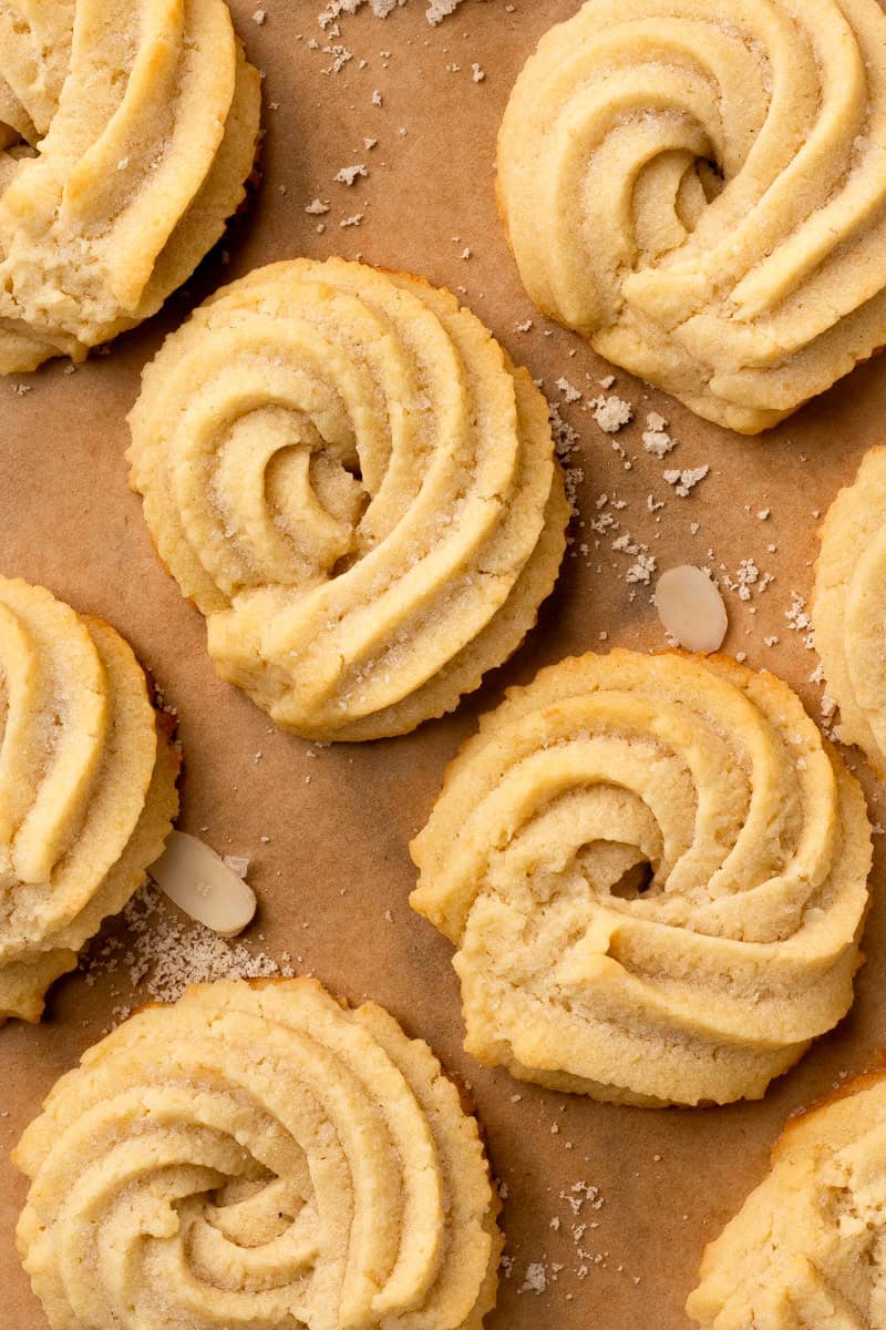 30-Minute Danish Gluten Free Butter Cookies on a tray with some slivered almonds