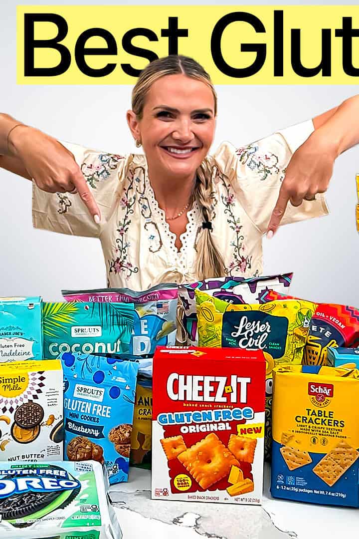 25+ gluten free snacks on a counter with a girl pointing to them